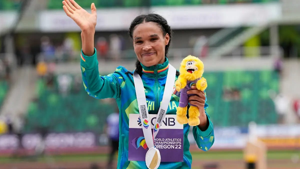 Letesenbet Gidey of Ethiopia waves after winning women's 10000m gold in Eugene.
