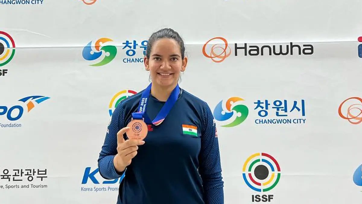 India's Anjum Moudgil poses with the ISSF Shooting World Cup bronze medal.  