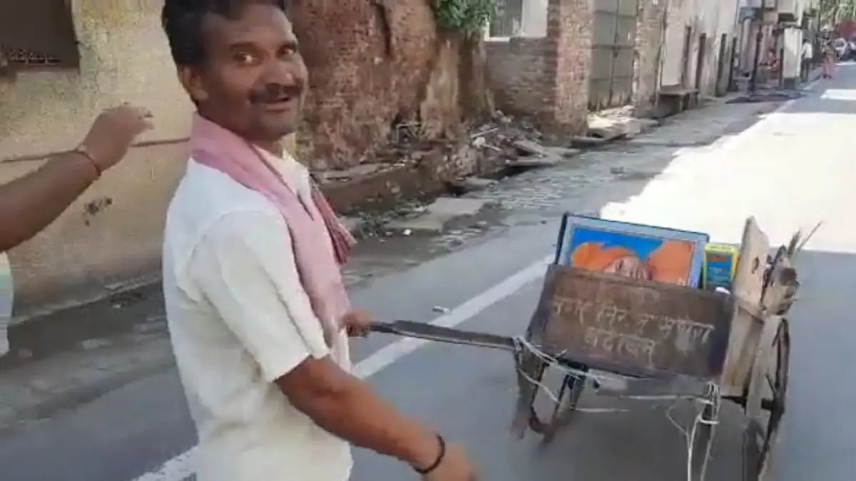 The sanitation worker with his garbage cart in Mathura.