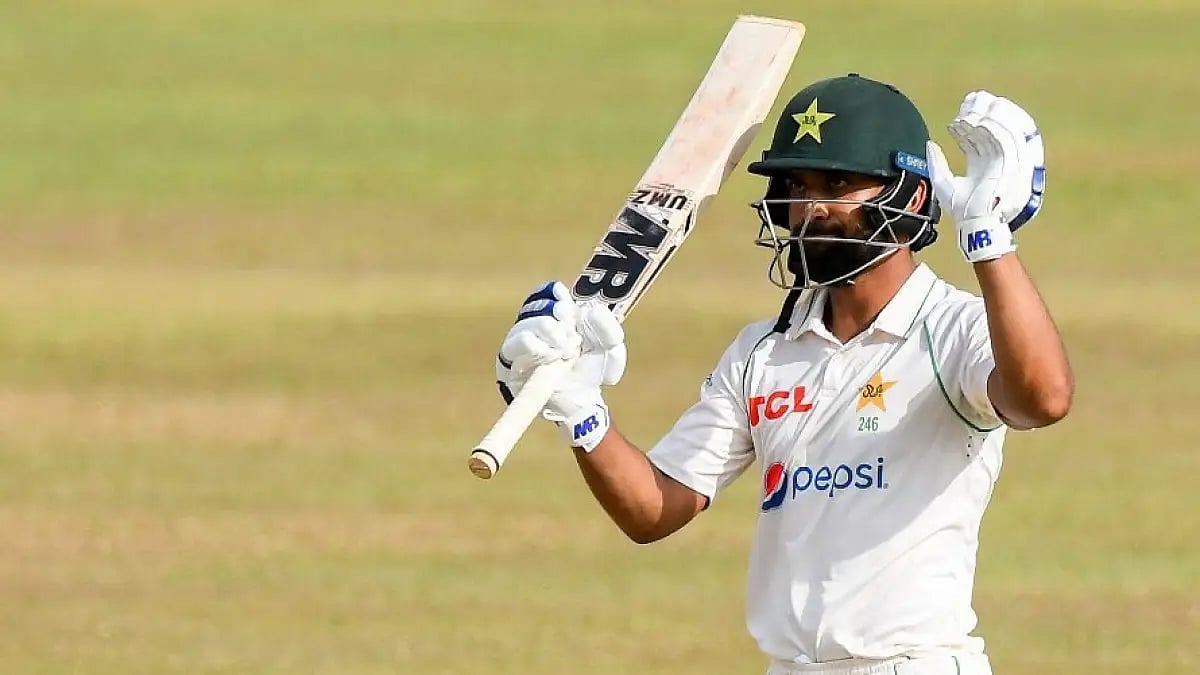 Abdullah Shafique celebrates after completing his century against Sri Lanka in Galle.  