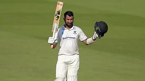 Cheteshwar Pujara celebrates after scoring his double ton for Sussex.