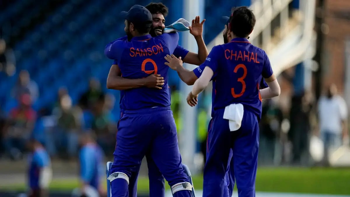 Teammates embrace Mohammed Siraj after India defeated West Indies by three runs in first ODI.