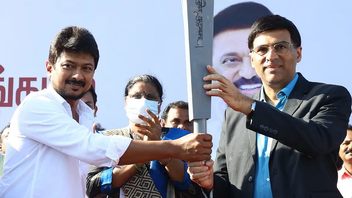 Grandmaster Vishwanathan Anand is handed over the Chess Olympiad torch in Mamallapuram.