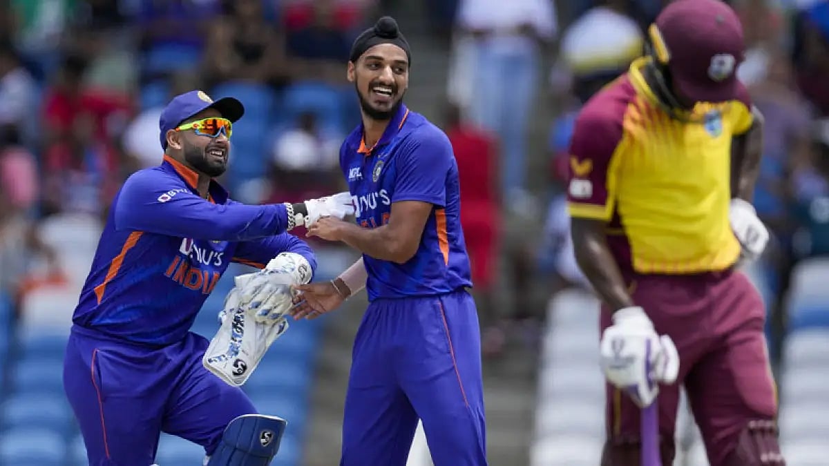 India's Arshdeep Singh and Rishabh Pant celebrate the fall of a West Indies wicket during first T20I.