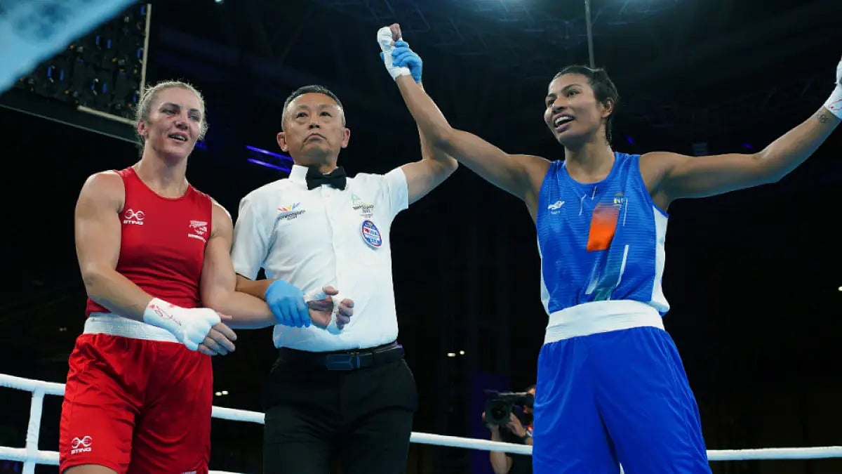Lovlina Borgohain (in blue) celebrates her victory at the Commonwealth Games 2022.