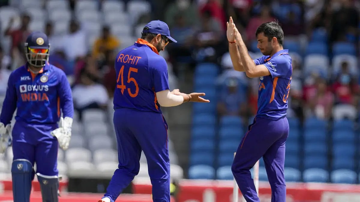India's cricketers celebrate the fall of a West Indies cricket during the first T20I cricket match in Tarouba, July 29, 2022.