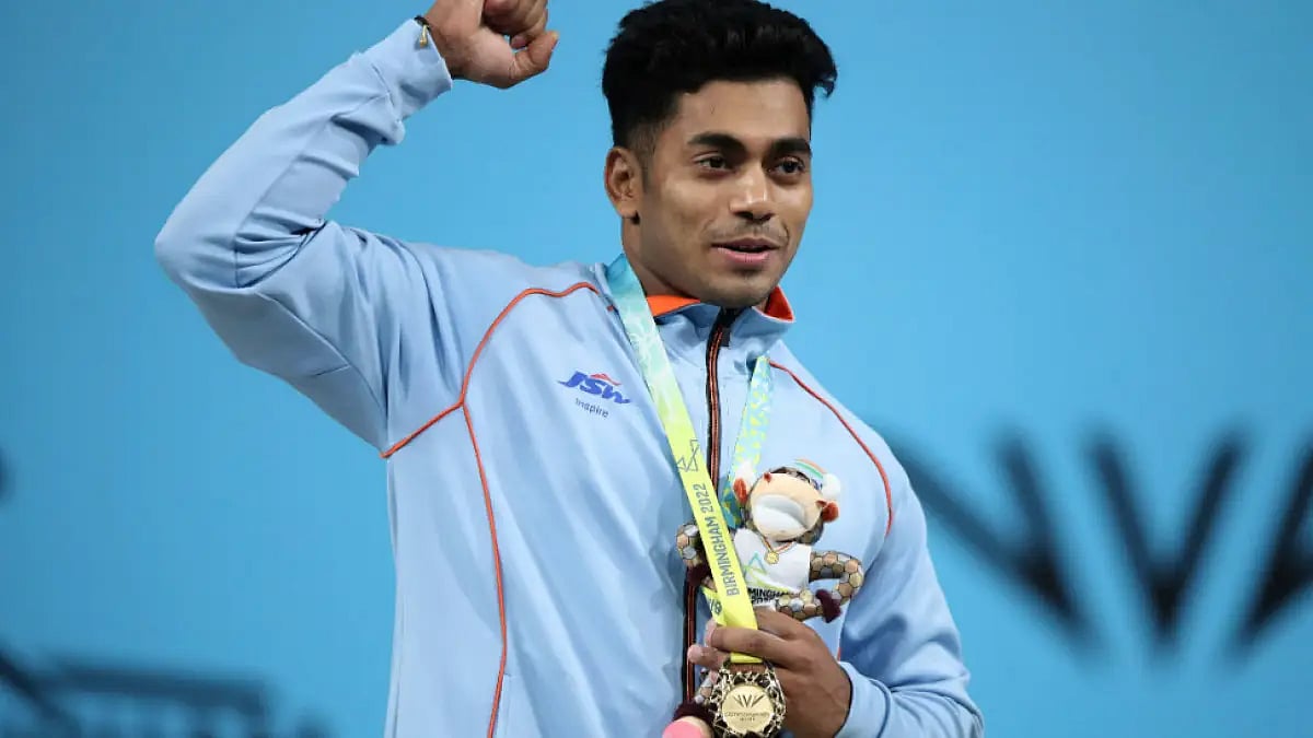 India's Achinta Sheuli celebrates after winning his Commonwealth Games 2022 gold medal.  - null