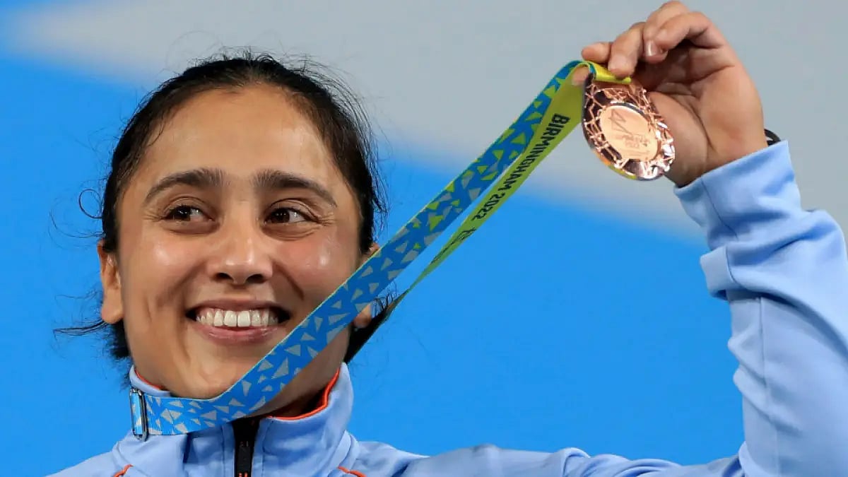 India's Harjinder Kaur flaunts her gold medal at Commonwealth Games 2022.  