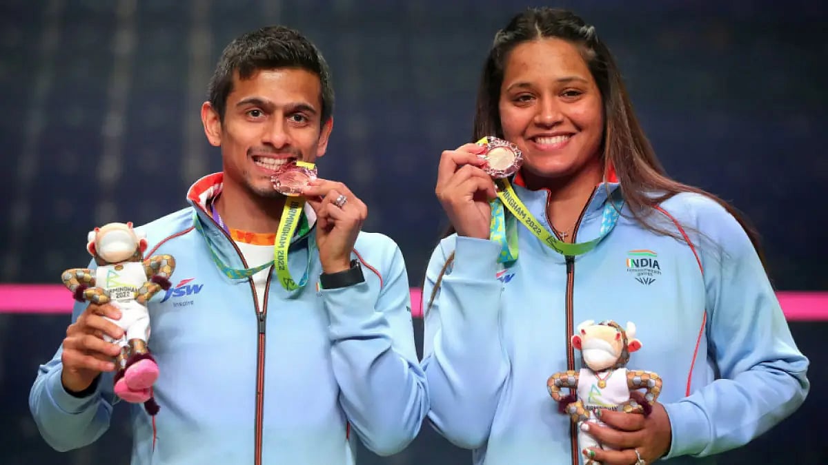 Dipika Pallikal and Saurav Ghosal pose with their Commonwealth Games 2022 squash bronze medals.  