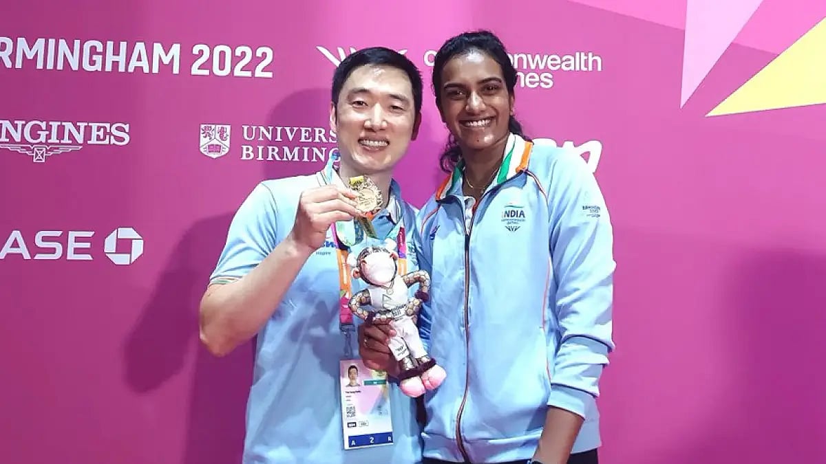 PV Sindhu and her coach Park Tae Sang pose with the Commonwealth Games 2022 gold medal. 