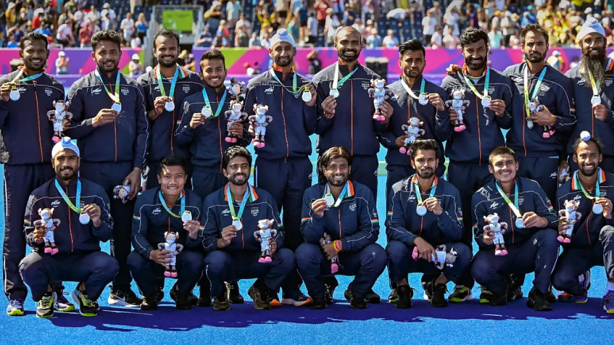 Indian hockey players celebrate their Commonwealth Games 2022 silver medal.  