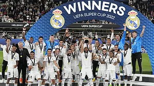 Real Madrid players celebrate with the trophy after winning the UEFA Super Cup 2022 against Eintrach