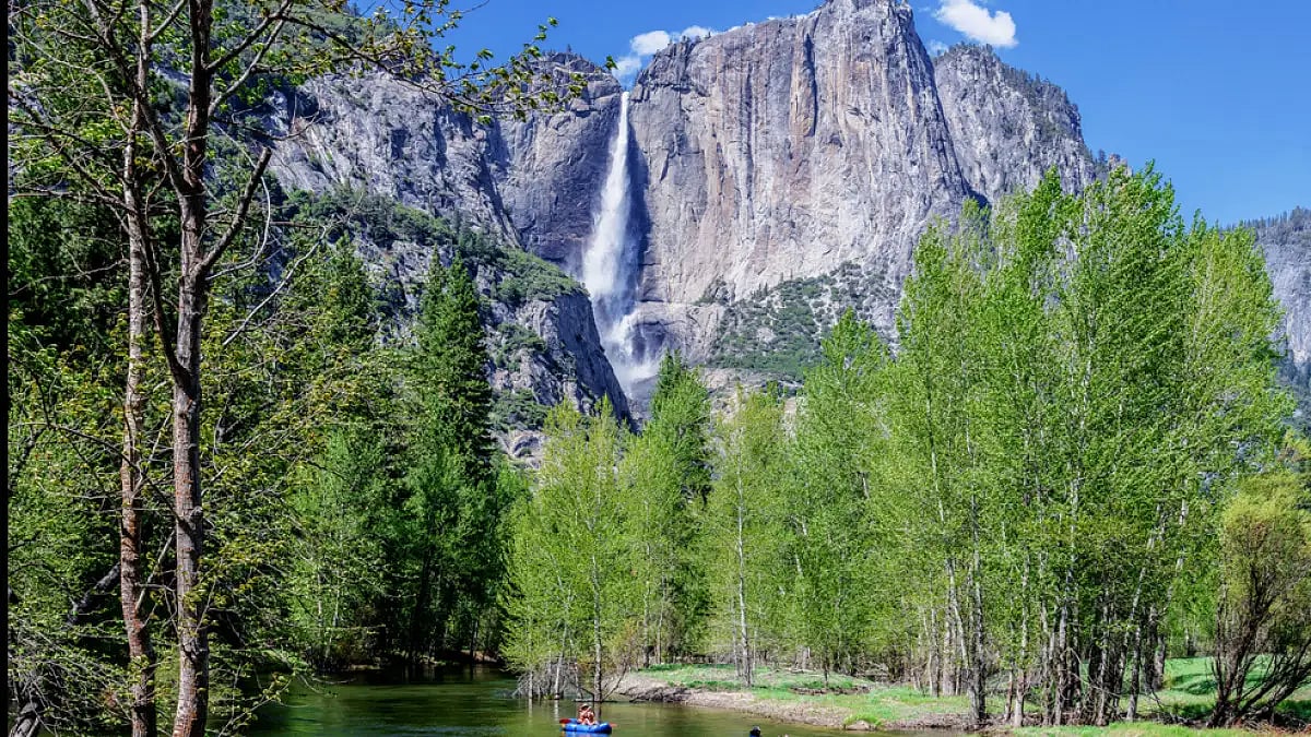 Rafting the Merced River as seen from the Swinging Bridge Yosemite Valley.