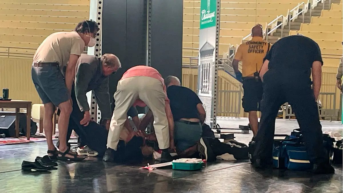 People tending to Salman Rushdie after he was attacked.