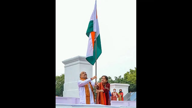 Home Minister Amit Shah Hoists National Flag At Residence