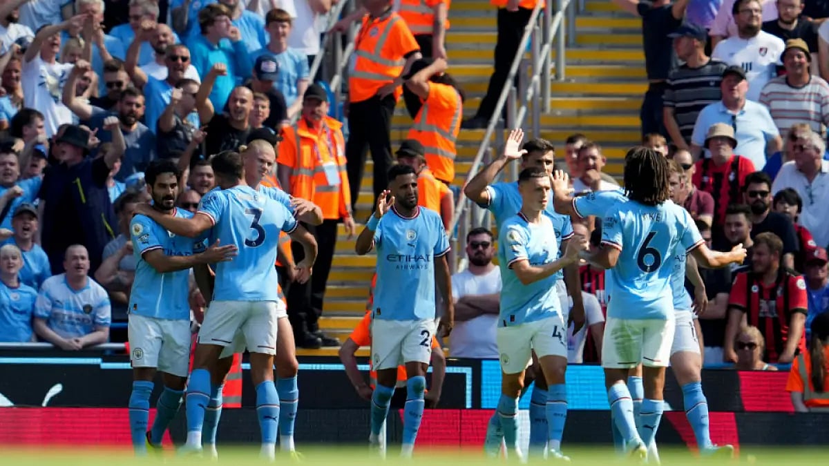 Manchester City players celebrate after scoring against Bournemouth in EPL.