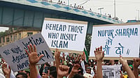 A photograph of a rally calling for the beheading of those insulting Islam