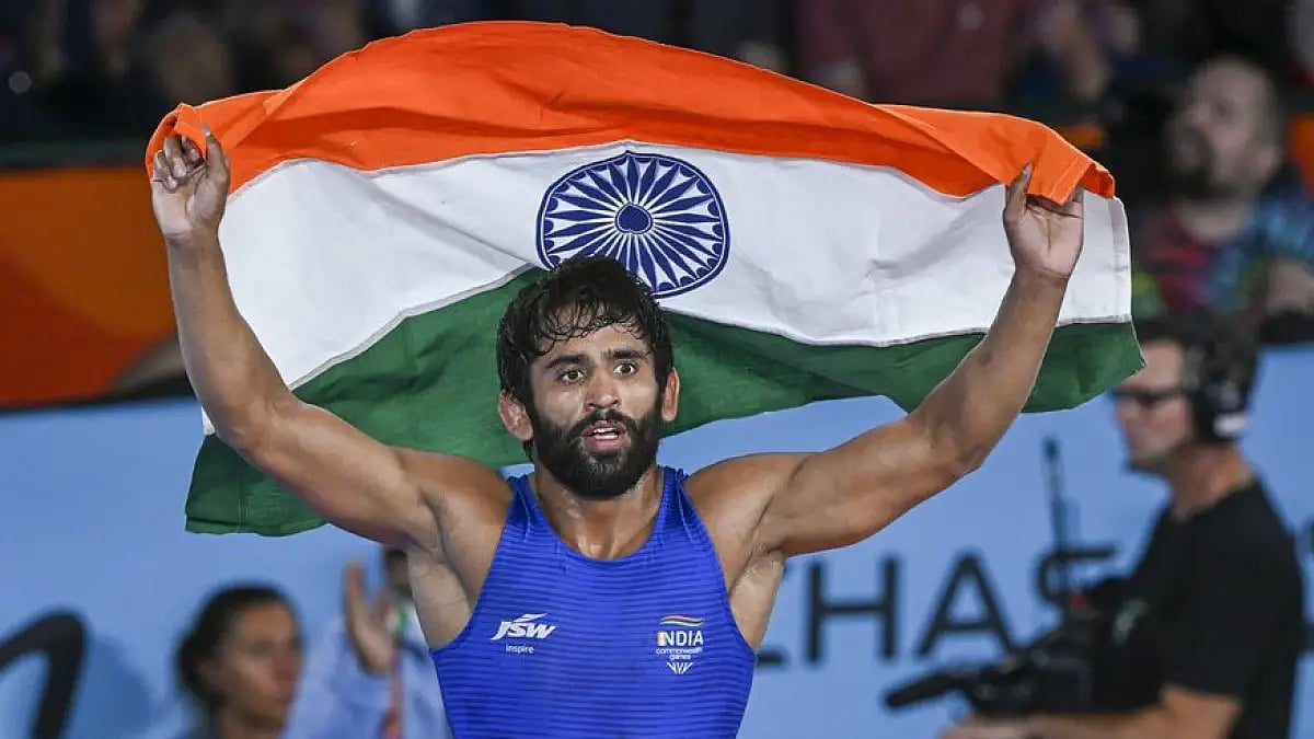 Bajrang Punia celebrates with the Tricolour after winning gold at Commonwealth Games 2022. 