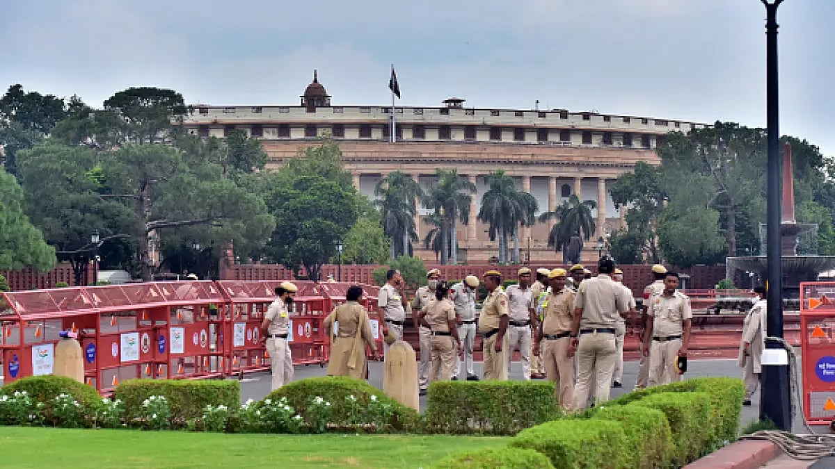 Police personnel gathered in front of the parliament building in New Delhi