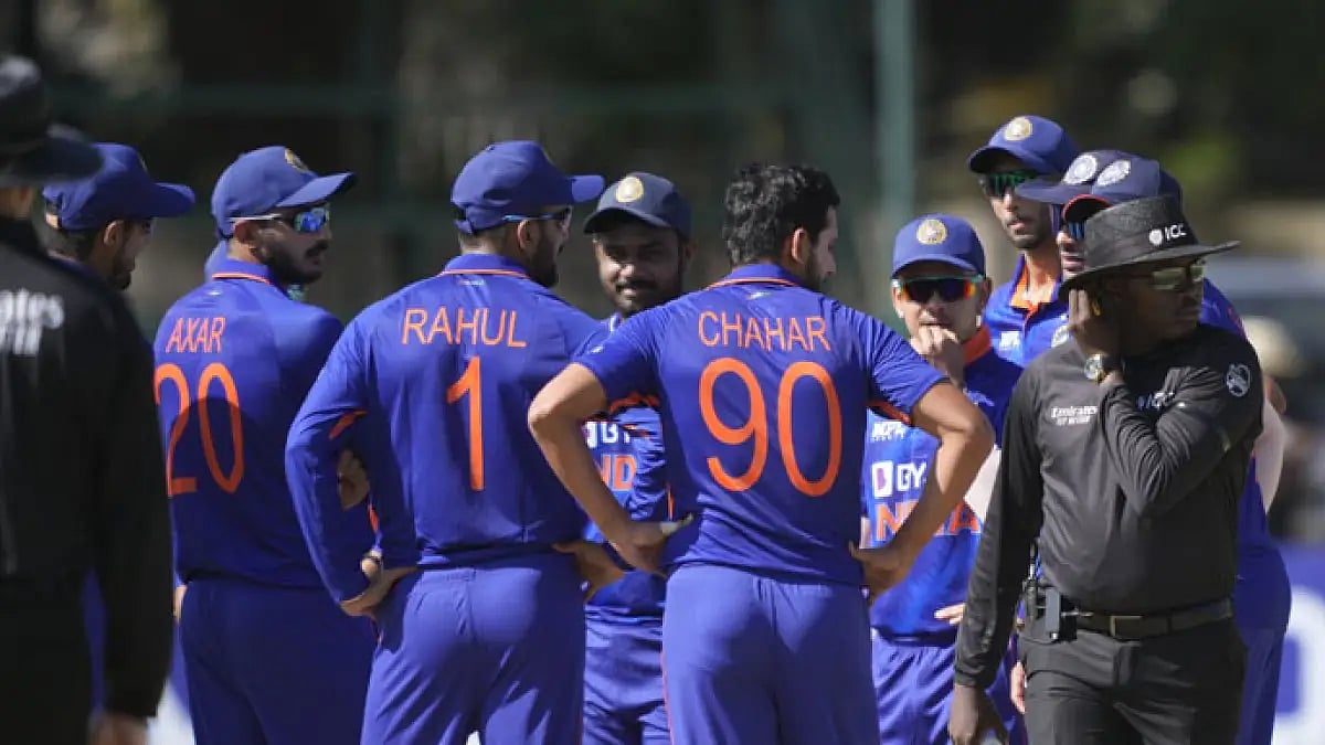 Indian cricketers wait for a third umpire decision during their first ODI against Zimbabwe in Harare.