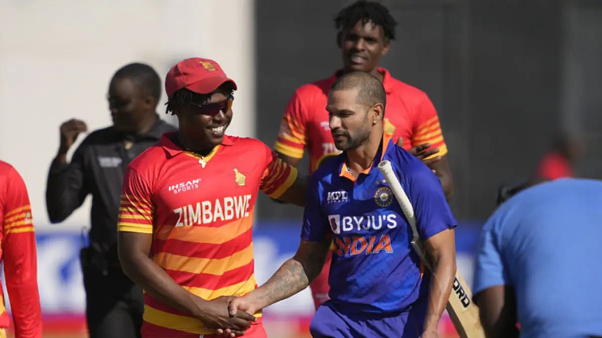 India batter Shikhar Dhawan with Zimbabwean players at the end of play 1st ODI in Harare.