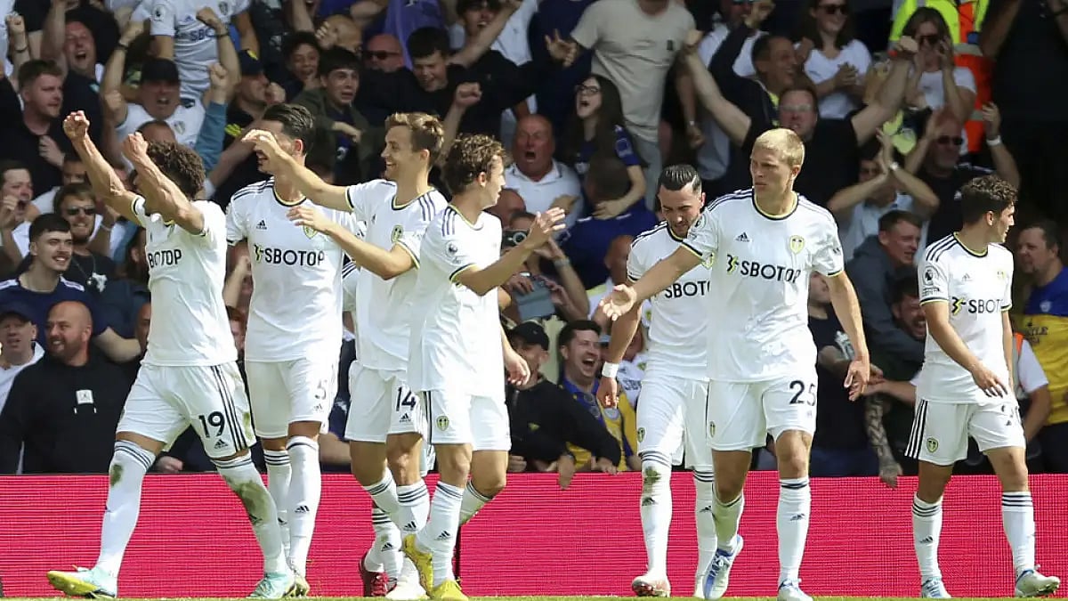 Leeds United players celebrate a Rodrigo against Chelsea.