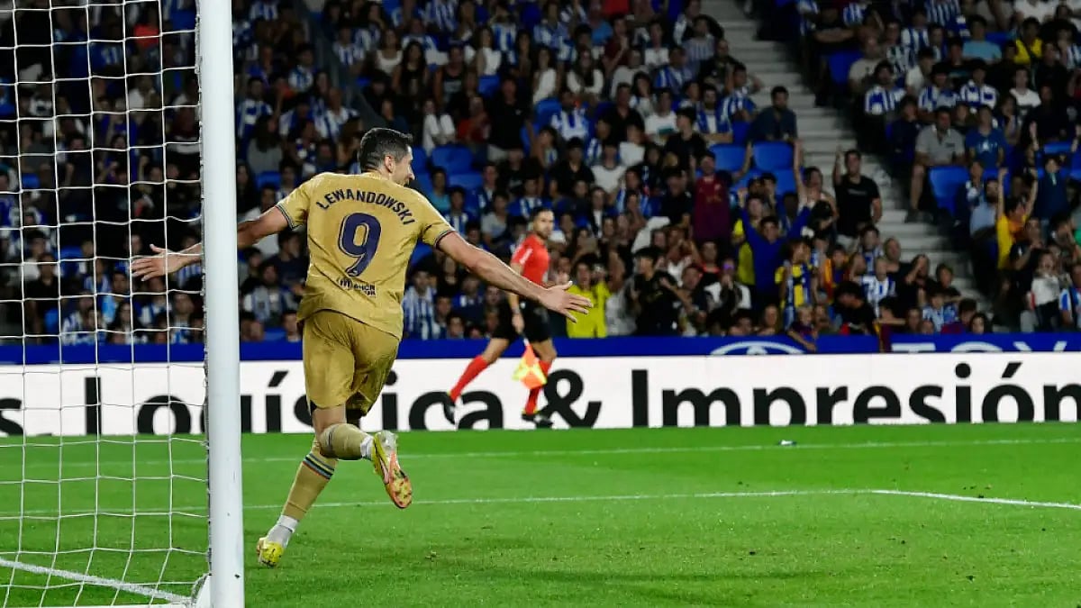 Barcelona's Robert Lewandowski celebrates after scoring against Real Sociedad in La Liga 2022-23. 