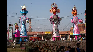 Effigies of Ravana and his brother and son wait to be set on fire
