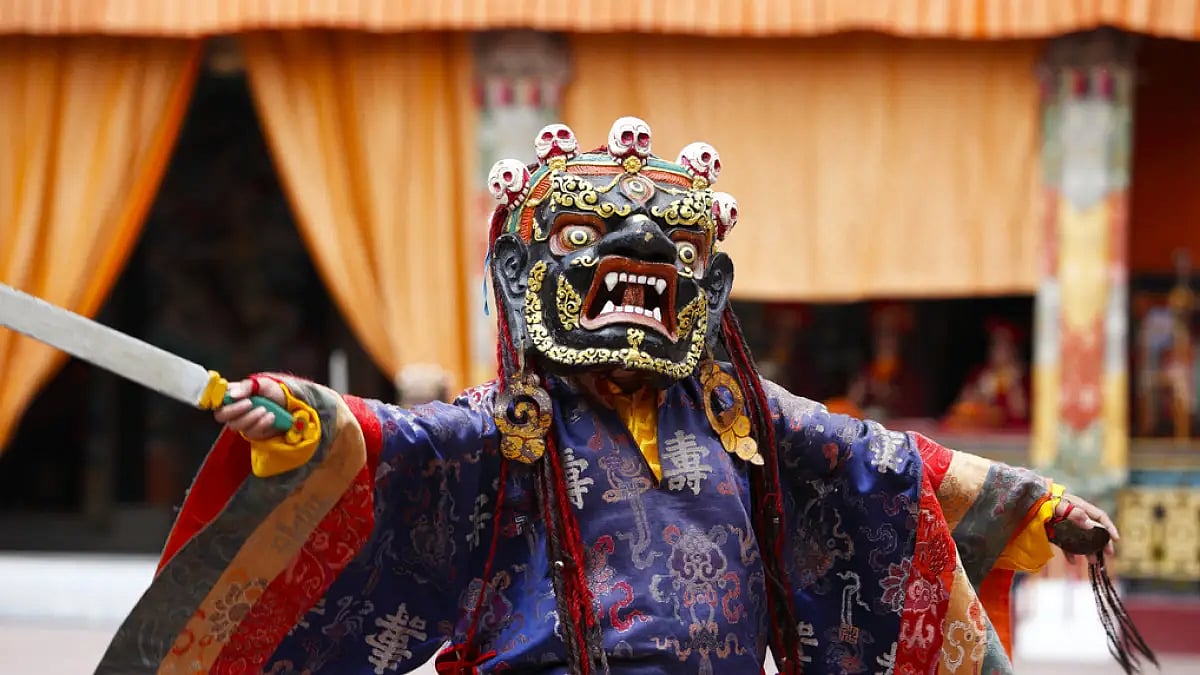 A masked dance in progress at the Rumtek monastery