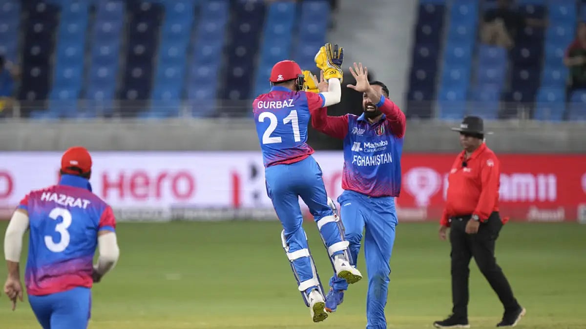 Afghanistan's Rahmanullah Gurbaz celebrates with Mohammad Nabi the wicket of Sri Lanka's Maheesh The