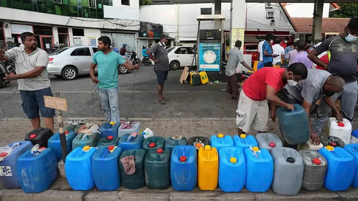People wait for fuel as Sri Lanka faces acute shortage of essentials amid its worst financial crisis