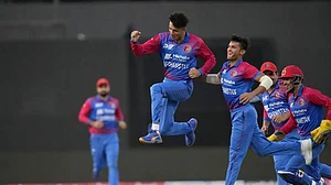 Afghanistan's Mujeeb-ur-Rahman celebrates with teammates the fall of Bangladesh's Shakib Al Hasan. Photo: AP