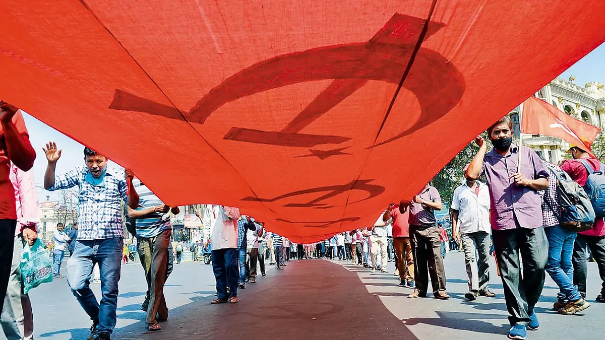 Disciplined: Supporters marching to a CPI(M) mass meeting in Kolkata in 2021