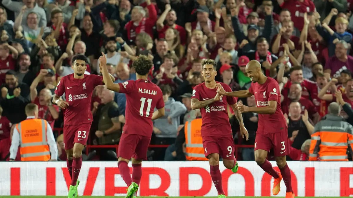 Liverpool players celebrate a goal against Newcastle United in English Premier League.
