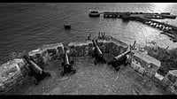 From time-polished steps of the Bandra fort to Mockingbird Café, what is it the poet searches for?