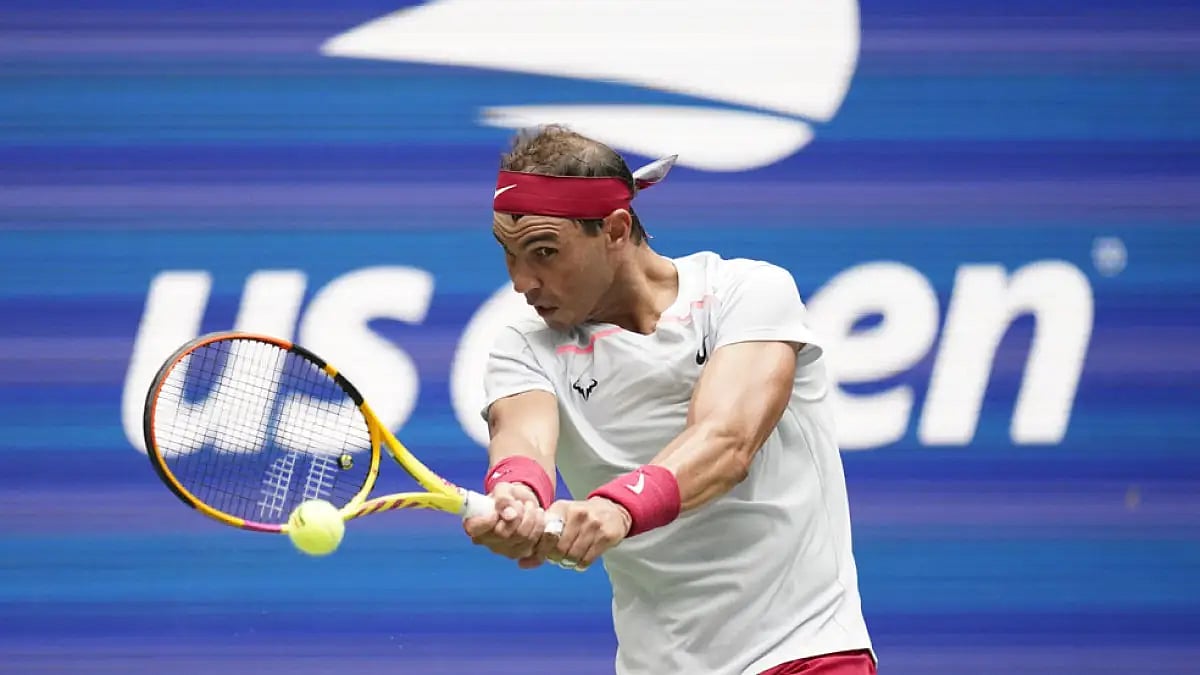 Rafael Nadal returns a shot to Frances Tiafoe during their US Open 2022, fourth round match.
