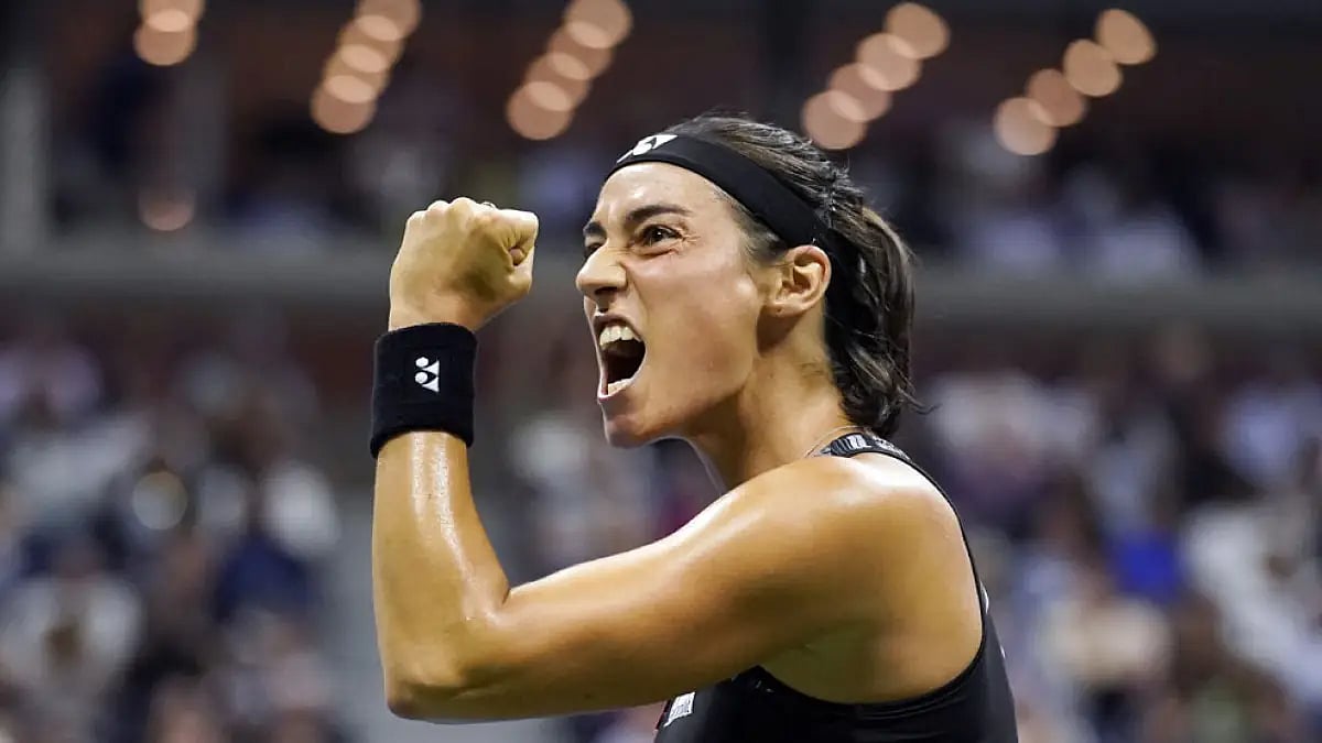 Caroline Garcia celebrates after winning a point against Coco Gauff.