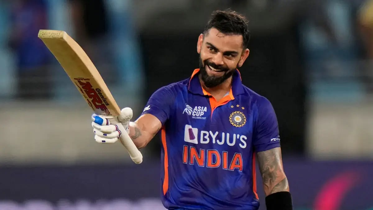 Virat Kohli celebrates his maiden T20I century against Afghanistan in an Asia Cup 2022 match. 