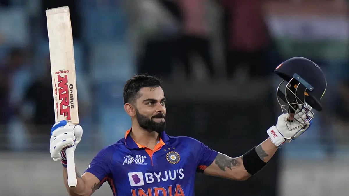 Virat Kohli celebrates scoring a century during India vs Afghanistan match.