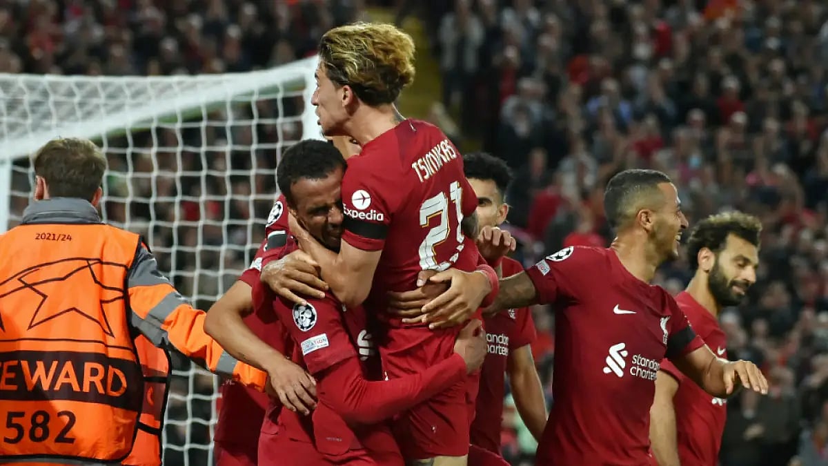 Liverpool players celebrate Joel Matip's (L) winner against Ajax in UEFA Champions League.