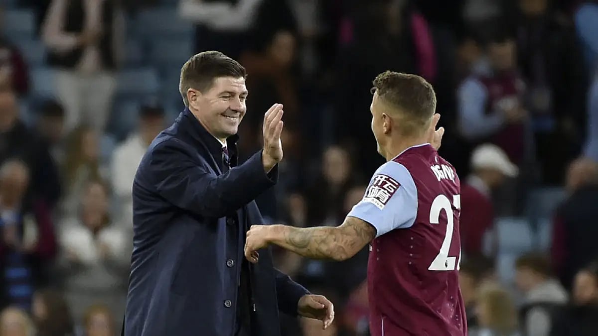 Aston Villa's head coach Steven Gerrard celebrates with Lucas Digne at the end of their match against Southampton.