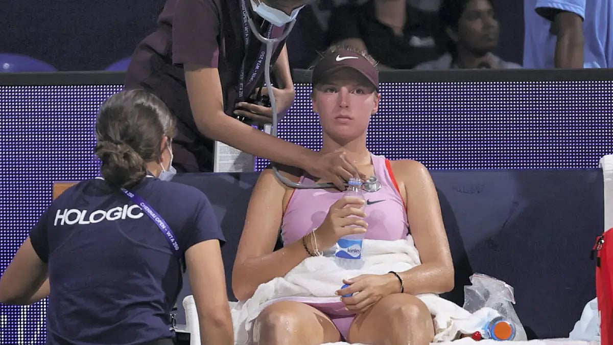 Linda Fruhvirtova receives medical care during her match against Nadia Podoroska.