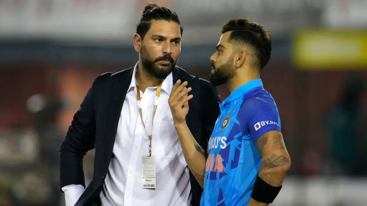 India's Virat Kohli (R) interacts with Yuvraj Singh before the start of the first T20I in Mohali.