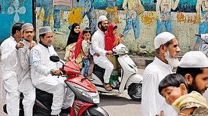 Muslims returning after Eid-ul Fitr prayer in the city