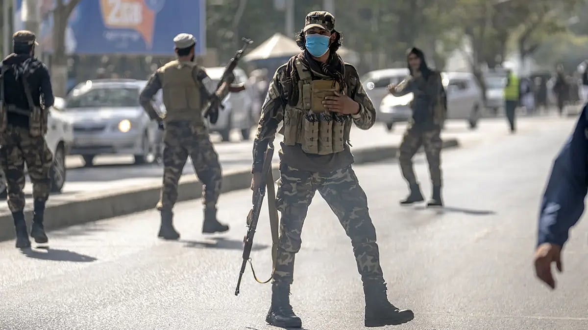 Taliban fighters stand guard at the site of an explosion in Kabul, Afghanistan. (Representative Image)