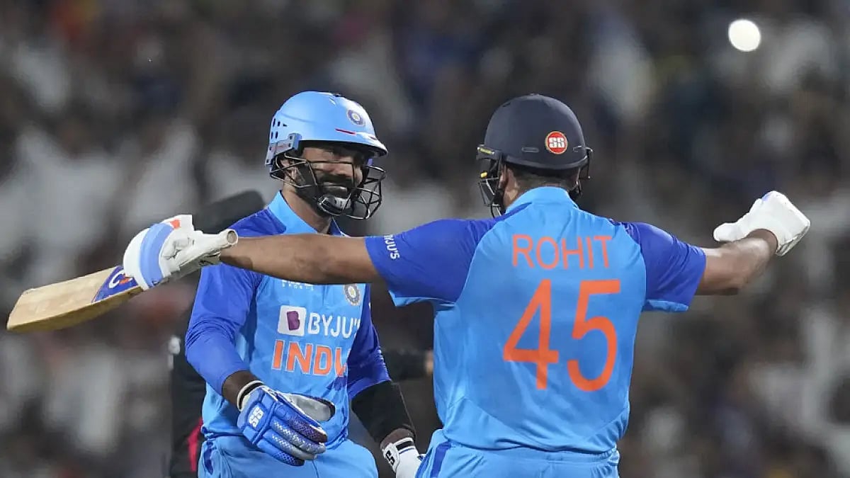 India's Dinesh Karthik, left, celebrates with Rohit Sharma after hitting a boundary to win the second T20 cricket match against Australia.
