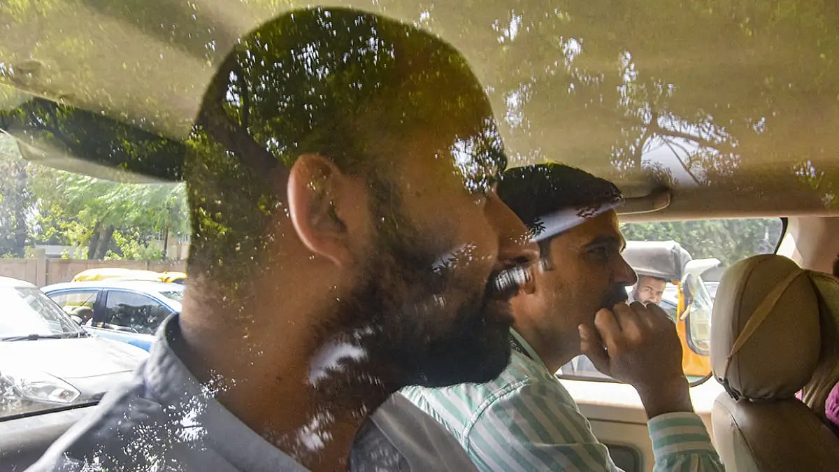 Vijay Nair produced at court in Delhi 