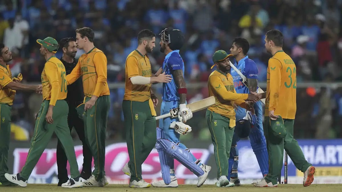 Indian (blue) and South African players greet each other after the end of first T20I match.