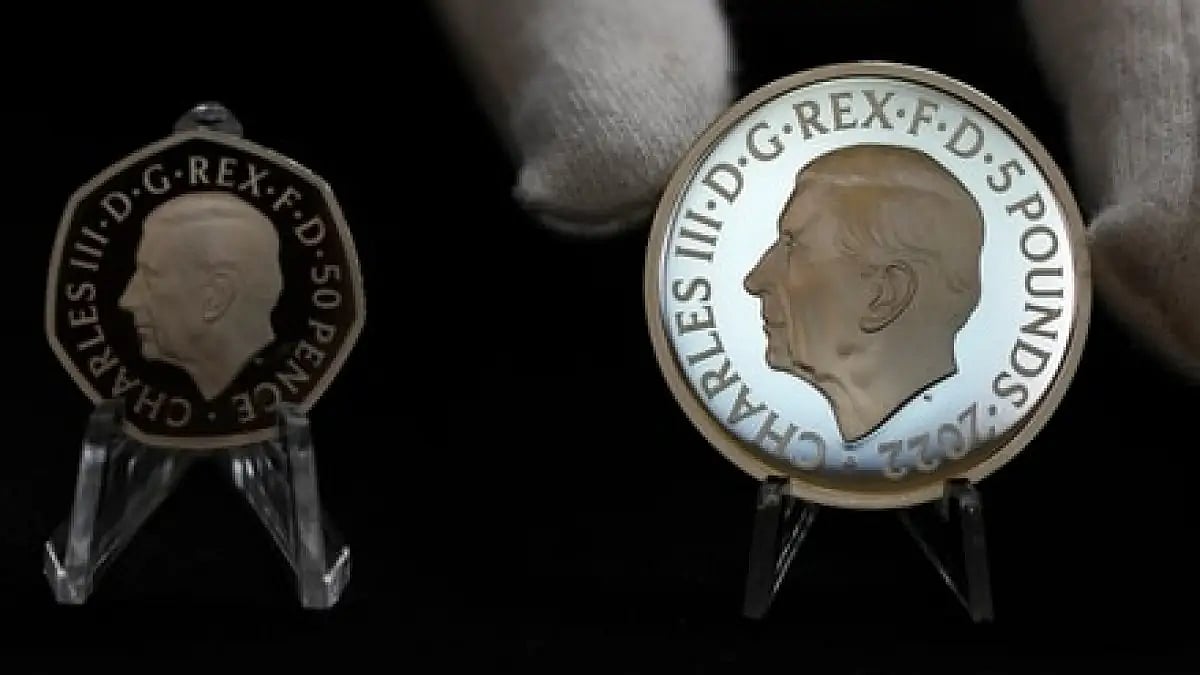 50 pence coin and 5 pounds coin with official coinage portrait of King Charles III