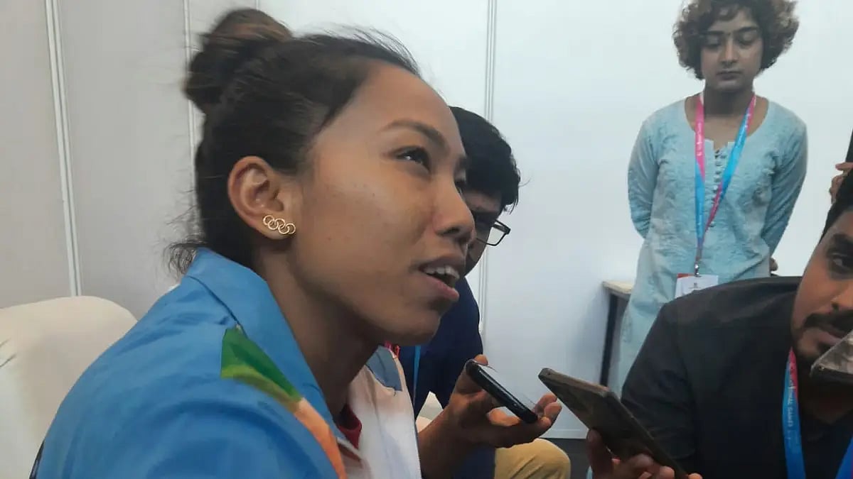 Mirabai Chanu speaks to the press after winning the women's 49kg gold at the National Games.